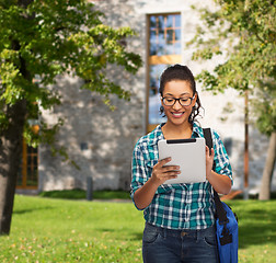 Image showing student in eyeglasses with tablet pc and bag