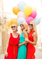 Image showing beautiful girls with colorful balloons in the city