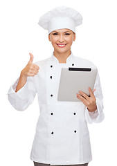 Image showing smiling female chef with tablet pc computer