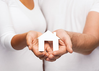 Image showing couple hands with paper house