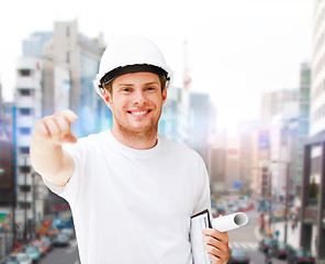 Image showing male architect in helmet pointing at you