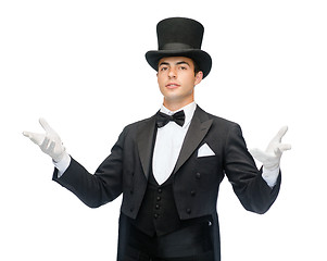 Image showing magician in top hat showing trick