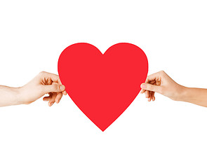 Image showing couple hands holding red heart