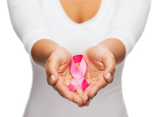 Image showing hands holding pink breast cancer awareness ribbon