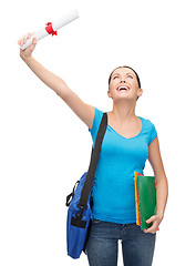 Image showing smiling student with bag and folders