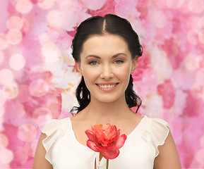 Image showing young and beautiful woman with flower