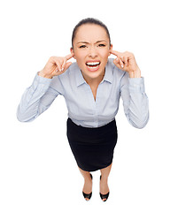 Image showing businesswoman screaming with closed ears