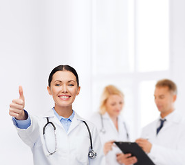 Image showing smiling female doctor with stethoscope