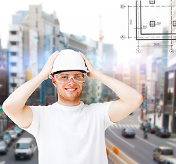 Image showing male architect in helmet with safety glasses