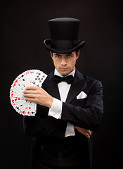 Image showing magician showing trick with playing cards