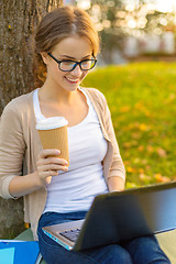 Image showing teenager in eyeglasses with laptop and coffee