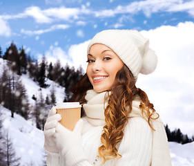 Image showing woman in hat with takeaway tea or coffee cup