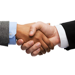 Image showing businessman and businesswoman shaking hands