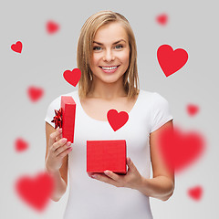Image showing smiling girl with gift box