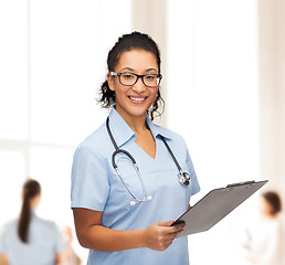 Image showing smiling female african american doctor or nurse