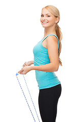 Image showing sporty woman with with skipping rope