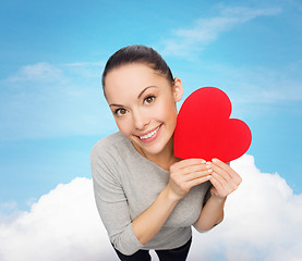 Image showing smiling asian woman with red heart