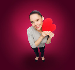 Image showing smiling asian woman with red heart