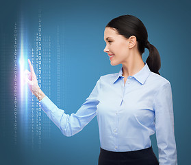 Image showing woman working with imaginary virtual screen