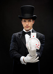 Image showing magician showing trick with playing cards