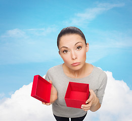 Image showing disappointed asian woman with empty red gift box