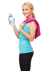 Image showing sporty woman with towel and watel bottle