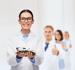 Image showing smiling female doctor with eyeglasses