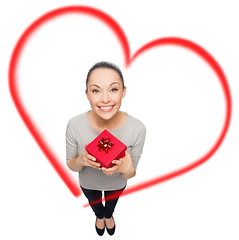 Image showing smiling asian woman with red gift box