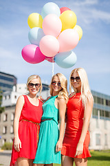 Image showing beautiful girls with colorful balloons in the city