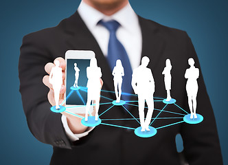 Image showing businessman showing smartphone with social network