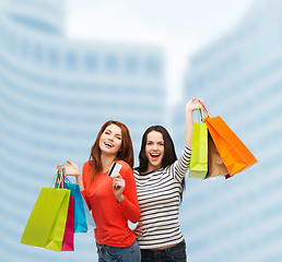 Image showing teenage girls with shopping bags and credit card