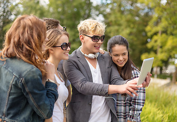 Image showing teenagers taking photo with tablet pc outside