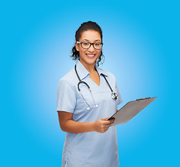 Image showing smiling female african american doctor or nurse