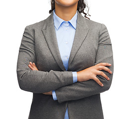 Image showing smiling businesswoman with crossed arms