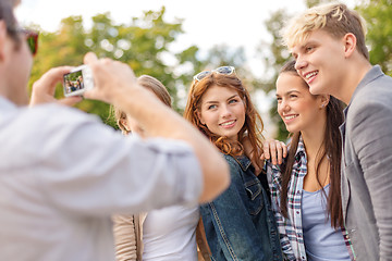 Image showing teenagers taking photo digital camera outside