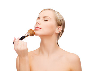 Image showing beautiful woman with makeup brush