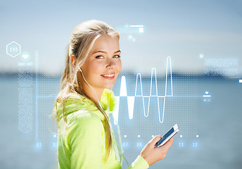 Image showing woman listening to music outdoors