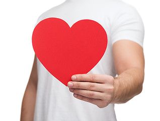 Image showing closeup of man hands with heart