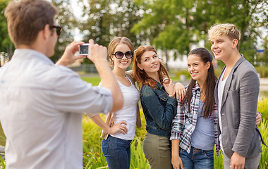 Image showing teenagers taking photo digital camera outside