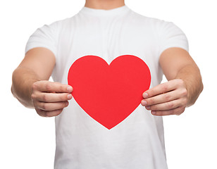 Image showing closeup of man hands with heart