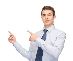 Image showing man pointing finger to something on virtual screen