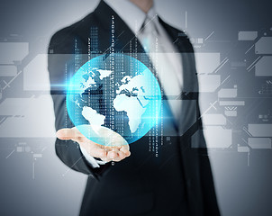 Image showing businessmans hand showing earth globe