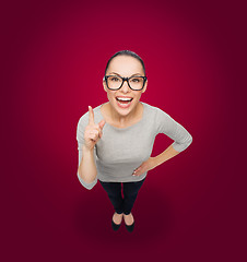 Image showing asian woman in eyeglasses with finger up