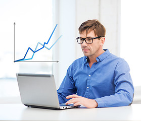 Image showing man working with laptop at home