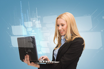 Image showing smiling woman with laptop computer