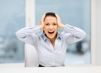 Image showing angry screaming businesswoman in office