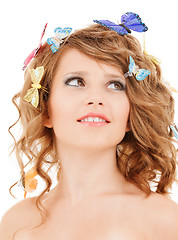 Image showing happy teen girl with butterflies in hair