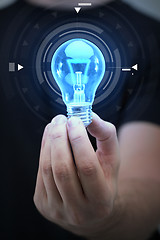 Image showing close up of man hand holding light bulb