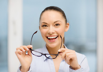 Image showing laughing businesswoman with glasses