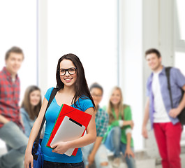 Image showing smiling student with bag, folders and tablet pc